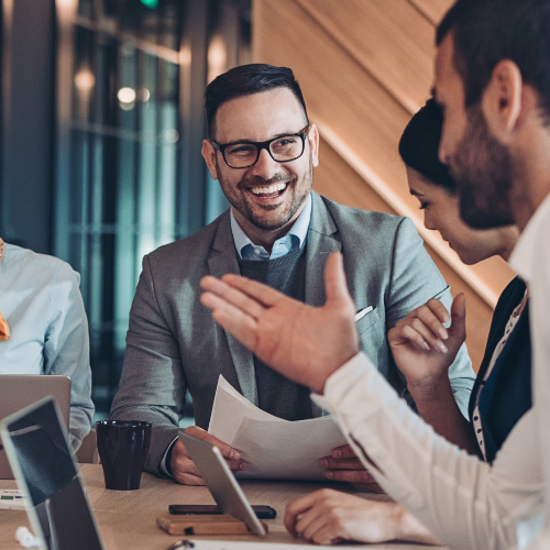 Colleagues talking in a modern office