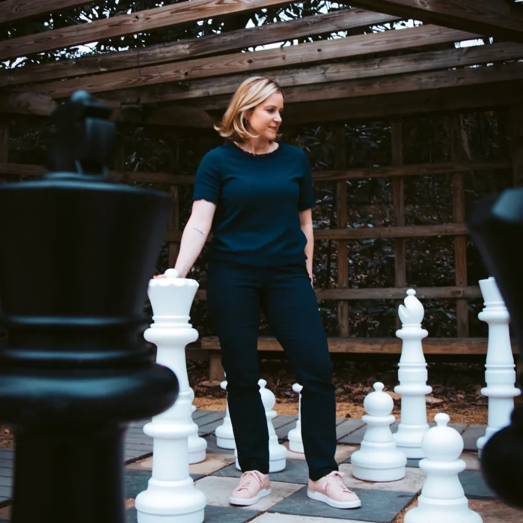 Holly Daniels playing giant chess outdoors