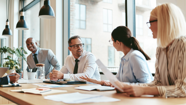 Colleagues talking around a conference table